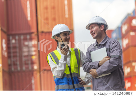 Business Team Cargo Container Shipping Inspection. Import and Export Freight at Port. Successful and accomplished work of teamwork Inspecting Containers Shipment. Shake hand and smile worker. Business Team Cargo Container Shipping Inspection. Import and Export Freight at Port. Successful and accomplished work of teamwork Inspecting Containers Shipment. Shake hand and smile worker. 141240997