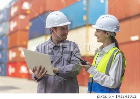 Business Team Cargo Container Shipping Inspection. Import and Export Freight at Port. Manager and Foreman Teamwork Inspecting Containers Shipment with success and happiness. Business Team Cargo Container Shipping Inspection. Import and Export Freight at Port. Manager and Foreman Teamwork Inspecting Containers Shipment with success and happiness. 141241012