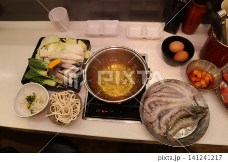 Hot Pot Ingredients and Setup on Kitchen Counter Hot Pot Ingredients and Setup on Kitchen Counter 141241217