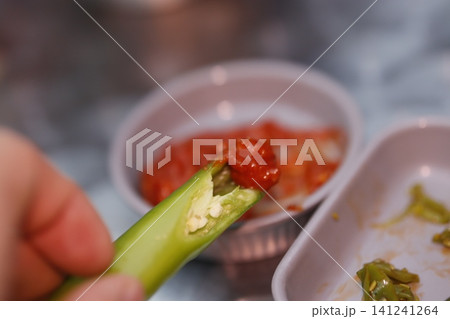 Green Pepper with Chili Sauce Close-up 141241264