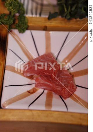 Raw Beef Slices on Decorative Plate Raw Beef Slices on Decorative Plate 141241683