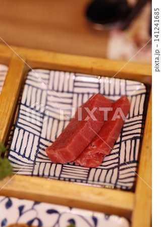 Fresh Slices of Raw Tuna on Traditional Plate 141241685