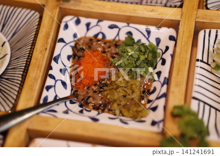 Japanese Dish with Toppings on Blue-White Plate Japanese Dish with Toppings on Blue-White Plate 141241691