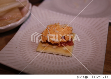 Cracker with Cheese and Tomato Spread Cracker with Cheese and Tomato Spread 141241713