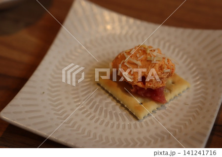 Cheese Dip with Crackers on White Plate Cheese Dip with Crackers on White Plate 141241716