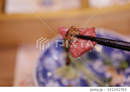 Raw Beef Slice on Chopsticks Raw Beef Slice on Chopsticks 141241763
