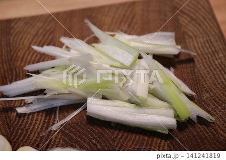 Chopped Scallions on Wooden Cutting Board Chopped Scallions on Wooden Cutting Board 141241819