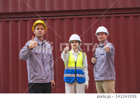 Engineer teamwork standing at container cargo. Export logistics transportation. teamwork success concept. Engineer teamwork standing at container cargo. Export logistics transportation. teamwork success concept. 141241938