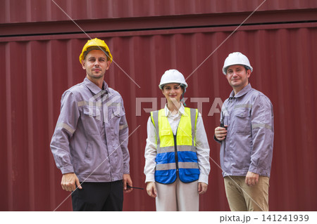 Engineer teamwork standing at container cargo. Export logistics transportation. teamwork success concept. Engineer teamwork standing at container cargo. Export logistics transportation. teamwork success concept. 141241939