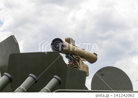 Close up view of an anti-tank guided missile launcher system mounted on a modern military armored vehicle. Close up view of an anti-tank guided missile launcher system mounted on a modern military armored vehicle. 141242062
