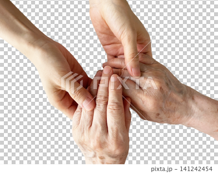 A woman's hand holding the hand of an elderly woman, against a white background. A woman's hand holding the hand of an elderly woman, against a white background. 141242454
