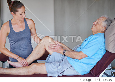 Woman, physiotherapist and senior patient with leg pain in elderly care for joint or stretching at clinic. Female person or chiropractor helping man in consultation for arthritis or ache at hospital 141243939