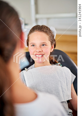 Happy, child and dentist at checkup appointment in clinic office for oral hygiene and health. Female, patient and orthodontist for braces, filling, cleaning and treatment on teeth from specialist Happy, child and dentist at checkup appointment in clinic office for oral hygiene and health. Female, patient and orthodontist for braces, filling, cleaning and treatment on teeth from specialist 141243964