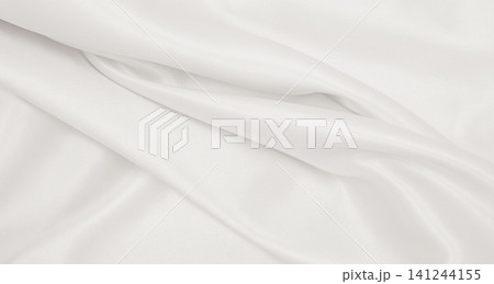 Smooth elegant golden silk or satin luxury cloth texture as wedding background. Luxurious background design. In Sepia toned. Retro style Smooth elegant golden silk or satin luxury cloth texture as wedding background. Luxurious background design. In Sepia toned. Retro style 141244155