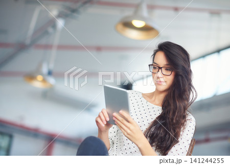 Tablet, office and business woman for online research, website news and browse internet. Professional, creative startup and person on digital tech for networking, typing email and communication Tablet, office and business woman for online research, website news and browse internet. Professional, creative startup and person on digital tech for networking, typing email and communication 141244255