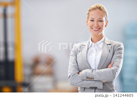 Business portrait or happy woman with arms crossed in warehouse, workshop or logistic startup. Face, pride or female employee smile at factory for supply chain, retail or online shopping and delivery Business portrait or happy woman with arms crossed in warehouse, workshop or logistic startup. Face, pride or female employee smile at factory for supply chain, retail or online shopping and delivery 141244605