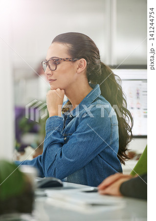Business woman, thinking and internet with planning in office with idea and graphic design project. Staff, professional and startup with a digital employee at a desk with ux work for company website Business woman, thinking and internet with planning in office with idea and graphic design project. Staff, professional and startup with a digital employee at a desk with ux work for company website 141244754