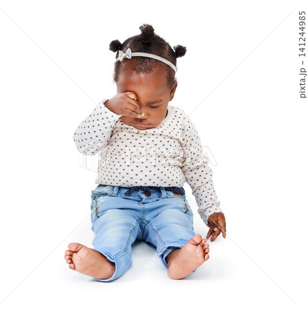 Child, tired and rubbing eyes in studio while sleepy from playing, learning and motor development in white background. Baby girl or infant, sitting and drowsy or sleeping for nap time, rest and peace Child, tired and rubbing eyes in studio while sleepy from playing, learning and motor development in white background. Baby girl or infant, sitting and drowsy or sleeping for nap time, rest and peace 141244985