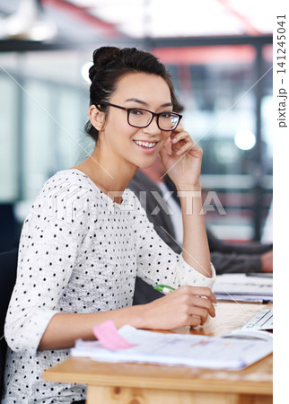Happy, portrait and creative woman at desk in office planning with notes for project or report. Professional, employee and person with a smile for productivity, process or work on development of idea Happy, portrait and creative woman at desk in office planning with notes for project or report. Professional, employee and person with a smile for productivity, process or work on development of idea 141245041