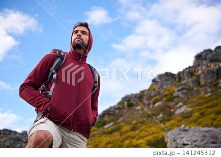 Man, hiking and mountain with bag in nature, Germany trail for conservation. Active, male person on adventure for health and wellness, confident explorer on backpacking for outdoor sport or walk 141245312
