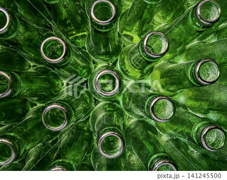 Abstract background of green glass bottles. Concept of glass recycling, reusable bottles, circular economy, bottle deposit return system (Pfand) and sustainable waste management. 141245500