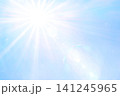 日中の太陽光_日差し_陽射し_青空_光学フレア_ゴースト_放射光_閃光｜光彩背景素材 141245965