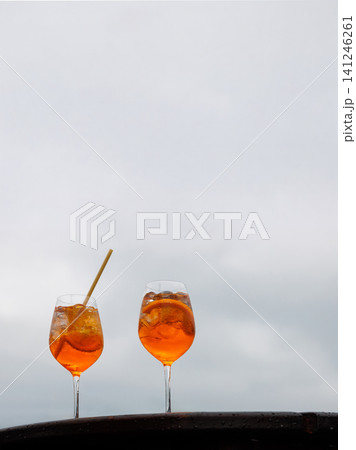 Two aperol spritz cocktails on ferry deck between Helsinki and Tallinn. Baltic maritime travel and hospitality scene 141246261