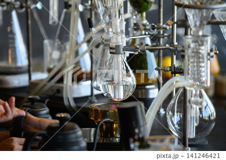 Laboratory Distillation Setup with Glass Flask and Heating Element in Scientific Research Environment Laboratory Distillation Setup with Glass Flask and Heating Element in Scientific Research Environment 141246421