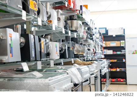 A Diverse Selection of Kitchen Appliances and Equipment Showcased in an Organized Store Aisle for Home Cooks and Culinary Enthusiasts A Diverse Selection of Kitchen Appliances and Equipment Showcased in an Organized Store Aisle for Home Cooks and Culinary Enthusiasts 141246822