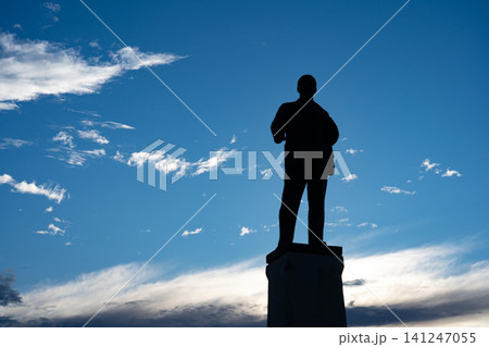 Silhouette of a Statue Against a Vibrant Sky 141247055