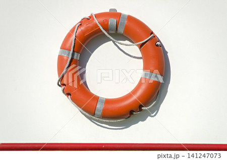 Life bouy on a white ship wall 141247073