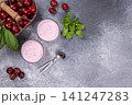 Cherry yogurt glasses with fresh fruit and mint 141247283