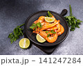 Cooked shrimp with lime and fresh parsley on a plate 141247284