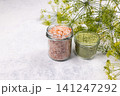 Himalayan pink salt and herb salt in jars with dill 141247292