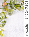 Dill and pink salt seasonings in glass jars 141247293