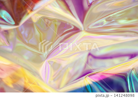 Abstract iridescent holographic foil texture with colorful pastel shimmer and glossy light reflections Abstract iridescent holographic foil texture with colorful pastel shimmer and glossy light reflections 141248098
