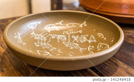 Traditional Korean Buncheong Stoneware Bowl with White Slip and 141248418