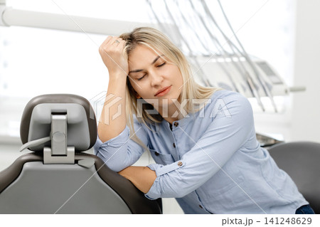 Patient suffering from toothache waiting for dentist in clinic 141248629