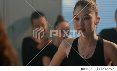 Teen Athletes Conflicting and Arguing inside Gymnastics Dressing Room 141248757