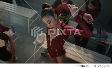 Rhythmic Gymnast Warming Up in Locker Room Before Competition Rhythmic Gymnast Warming Up in Locker Room Before Competition 141248780