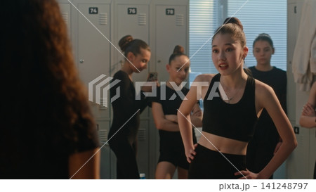 Young Female Mock, Intimidate Curly Haired Teammate While One Girl Records Incident on Smartphone 141248797