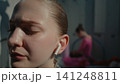 Lonely Teen Gymnast Finding Escape in Music Before Big Performance 141248811