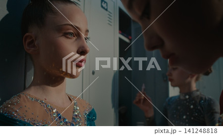 Teen Female Athletes Doing Makeup in Modern Locker Room Teen Female Athletes Doing Makeup in Modern Locker Room 141248818