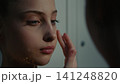 Focused Rhythmic Gymnasts Perfecting Stage Look inside Studio Changing Room 141248820