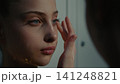 Focused Rhythmic Gymnasts Perfecting Stage Look inside Studio Changing Room 141248821