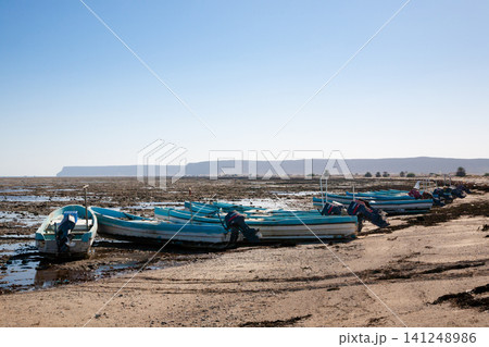 Al Bahadur beach view, Oman landmark. Boats on beach Al Bahadur beach view, Oman landmark. Boats on beach 141248986