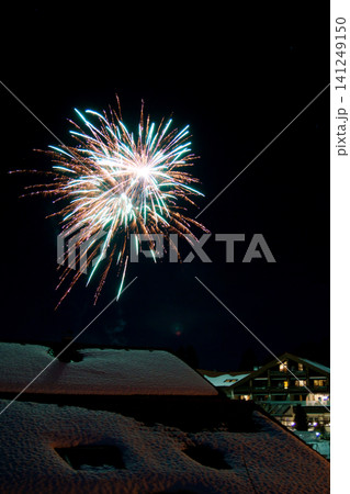 Oberstaufen, Germany, January 01 2018: New Year fireworks in the night sky 141249150