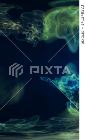 Green and blue translucent smoke wisps on a dark background, creating a mysterious abstract energy composition. Green and blue translucent smoke wisps on a dark background, creating a mysterious abstract energy composition. 141249223