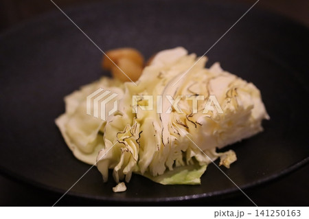 Artfully Presented Cabbage Dish with Garnish 141250163