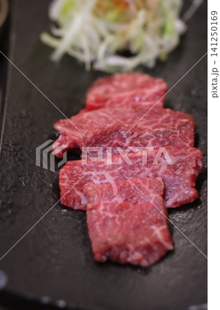 Sliced Wagyu Beef on Slate Plate with Shredded Vegetables Sliced Wagyu Beef on Slate Plate with Shredded Vegetables 141250169
